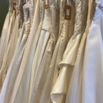 Photo of prom dresses hanging on a rail by Mandy Eelman on Unsplash
